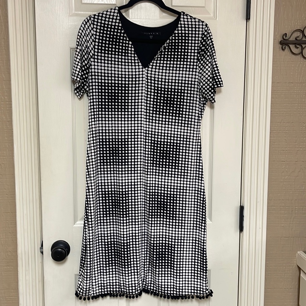 Tiana B. Size 12 dress. Very nice. Black and white. See pictures of the hem.